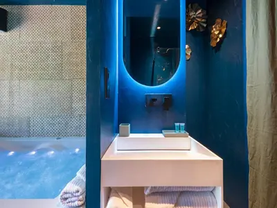a bathroom with a sink and a tub at LOVE IN L'ISLE/SORGUE Le crépuscule in LʼIsle-sur-la-Sorgue