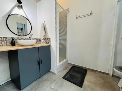 a bathroom with a sink and a mirror at L'Aixalté - T2, Vieille Ville in Aix-en-Provence