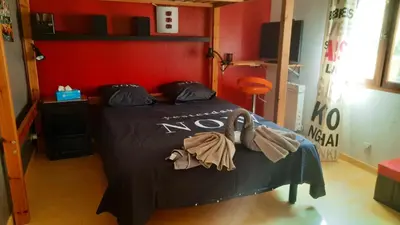 a bed in a room with a no sign on it at Villa charmante à Mérindol avec piscine privée in Mérindol
