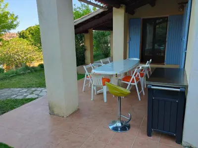 a table and chairs sitting on a patio at Roussillon in Roussillon