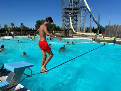 a young man jumping in a swimming pool at vacances en provence olivier in Mormoiron