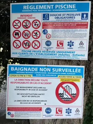 a sign that says no swimming and other prohibited signs at Superbe annAix de villa - Maison Odonata in Aix-en-Provence