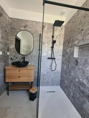 a bathroom with a shower with a sink and a mirror at Villa de luxe en Provence Piscine Chauffée in Puget