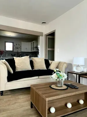 a bedroom with a blue bed with two night tables at Appartement spacieux et charmant in Caumont-sur-Durance