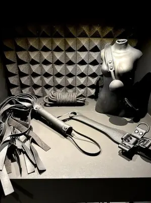a table with a hairdryer and a hair dryer and a hair at BDSM TanTra Love Room & SPA in Miramas