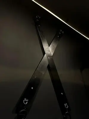 a pair of scissors hanging from a metal pole at BDSM TanTra Love Room & SPA in Miramas