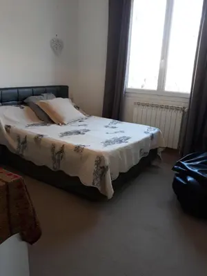 a bedroom with a bed with a blanket on it at Lumière de Provence in Mollégès