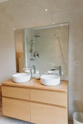 a bathroom with two sinks and a mirror at Maison en Provence avec piscine in Éguilles