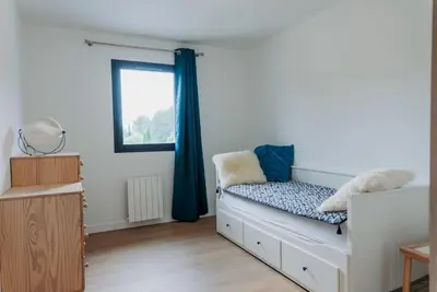 a bedroom with a bed and a window at Maison en Provence avec piscine in Éguilles