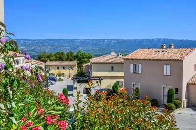 a view of a village with flowers at Les Coteaux de Pont Royal en Provence - maeva Home - Maison chaleureuse climatisée 4 pièces 6 personnes - Prestige - super Home MAE-2304 in Mallemort