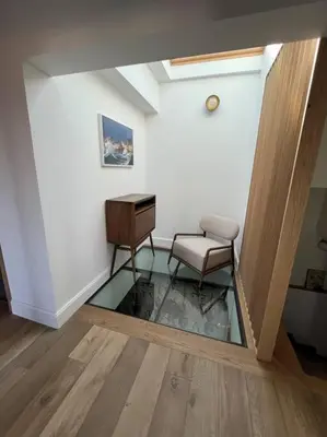 a room with a desk and a chair and a glass floor at Villa de charme in Châteauneuf-de-Gadagne