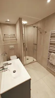 a bathroom with a white sink and a shower at Mas Sourso in Eygalières