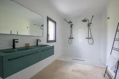 a bathroom with a green sink and a mirror at Mas Etienne Piscine&Nature Saint-Rémy Conciergerie in Saint-Rémy-de-Provence