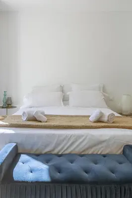 two beds with towels on them in a bedroom at Mas Etienne Piscine&Nature Saint-Rémy Conciergerie in Saint-Rémy-de-Provence