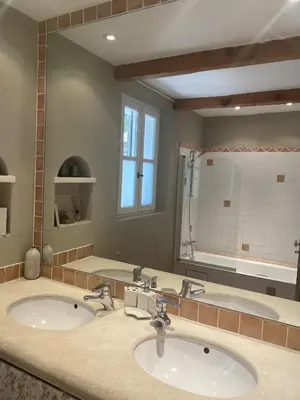 a bathroom with two sinks and a large mirror at La Bergerie Provencale - Luberon - Provence - villa with heated pool in Roussillon
