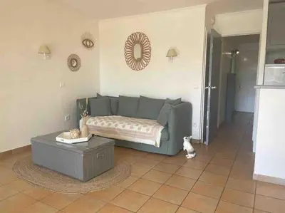 a bedroom with a large bed with two pillows at Vue lac avec accès piscine à vague in Mallemort