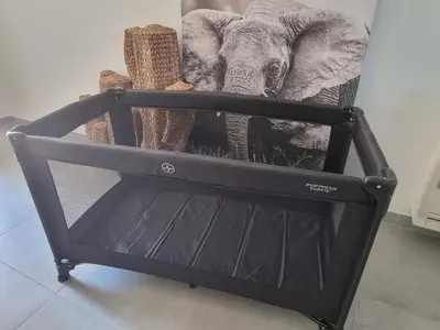 a black chair with an elephant on top of it at Ma Charmante Maison En Provence in Lançon-Provence