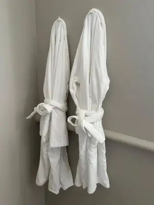 a pair of white towels hanging on a wall at CABADOL - Appartement Aix centre historique - très calme - 50m cours Mirabeau in Aix-en-Provence