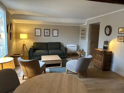 a living room with a couch and a table at CABADOL - Appartement Aix centre historique - très calme - 50m cours Mirabeau in Aix-en-Provence