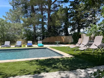 a group of chairs and a swimming pool at Superbe bas de villaIX - Maison Odonata in Aix-en-Provence