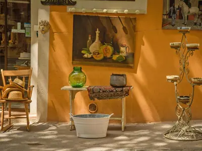 a room with a table and a painting on the wall at Liodrey in Céreste