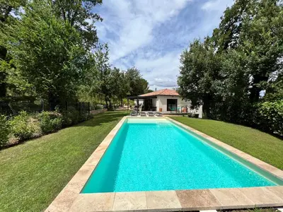 a swimming pool in the yard of a house at Luxury Villa with Pool en Provence in Le Puy-Sainte-Réparade