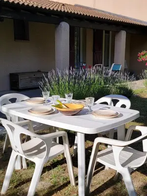 a white table with chairs and plates on it at Maison T4, campagne Provençale calme, tout confort in Lambesc