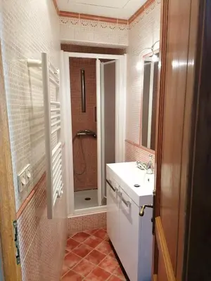 a bathroom with a sink and a shower in it at Chambre d'hôte in Crillon-le-Brave