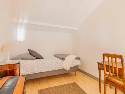 a bedroom with a bed and a desk and a chair at Holiday Home Le Mas de Marius by Interhome in Cavaillon