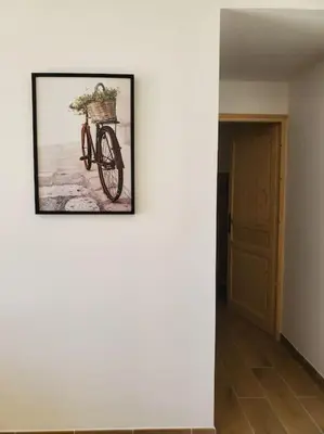 a picture of a bike with a basket on the wall at Rêve en Lubéron in Lauris