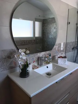 a bathroom with a sink and a mirror at La villa MARIE in Cavaillon
