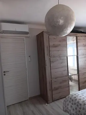 a bedroom with a bed and a large orb at La villa MARIE in Cavaillon