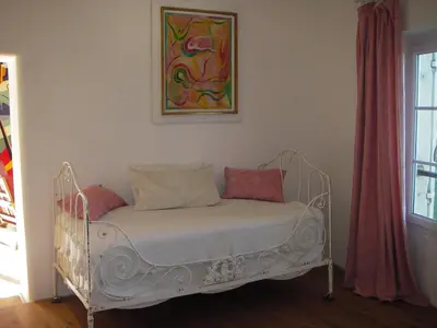 a white bed with two pillows in a room at Pavillon de Beauregard in Aix-en-Provence