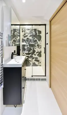 a bathroom with a shower and a sink and a mirror at Charmante maison de village au coeur du Luberon in Cucuron