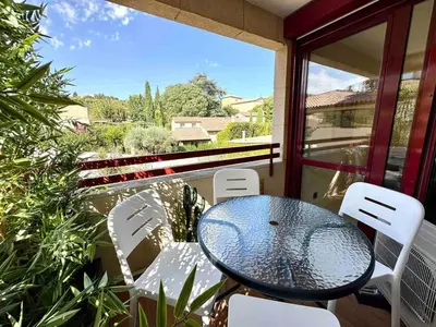 a table and chairs on a balcony with a view at Centre ville AIX - Terrasse / Ascenseur - Rénové in Aix-en-Provence