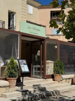 a store with a sign in front of a building at LES CISTES in Mallemort