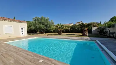 a swimming pool in the backyard of a house at La perle du sud in Carpentras