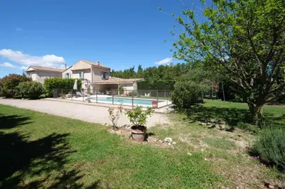a house with a swimming pool in a yard at mas attached to another building with private pool 4 people in carpentras, at the foot of the ventoux in provence. in Carpentras