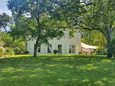 a large white house with a large yard at Lou Pantai, Bed and Breakfast, Delux Bedroom with AC in Aix-en-Provence