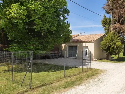 a fence in front of a house at Petite maison en campagne in Pernes-les-Fontaines