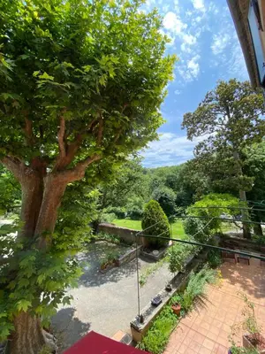 a view of a garden from the balcony of a house at Le mas de l'Auzon in Carpentras