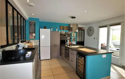 a kitchen with a white refrigerator and a sink at Gorgeous Home In Aubignan in Aubignan