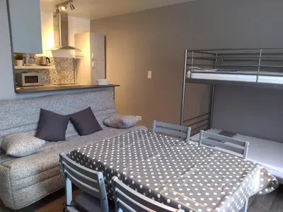 a bedroom with a bed and a bunk bed at Les Studios proche du Mont Ventoux in Mazan