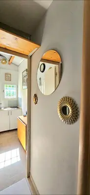 a kitchen with a mirror on the wall at La pause en luberon in Cavaillon