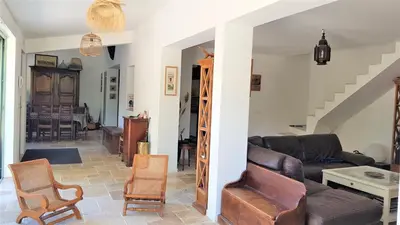 a living room with a couch and a table at Chambre d'hôte BB proche d'Aix en Provence in Éguilles