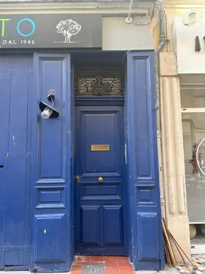 a blue door in front of a building at Magnifique appartement centre historique in Aix-en-Provence