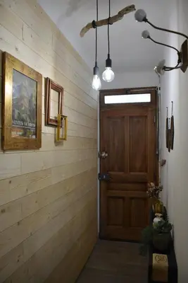 a hallway with a wooden wall with a wooden door at Villa ELISABETH in Aix-en-Provence