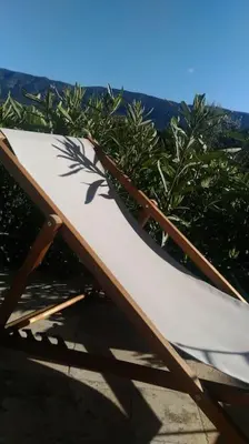 a wooden bench with a plant painted on it at Gite LE PETIT LUBERON COQUELICOT in Coustellet