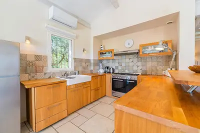a bathroom with a shower and a sink and a mirror at Villa sur 1 hectare 15 Personnes GORDES & ROUSSILLON in Croagnes