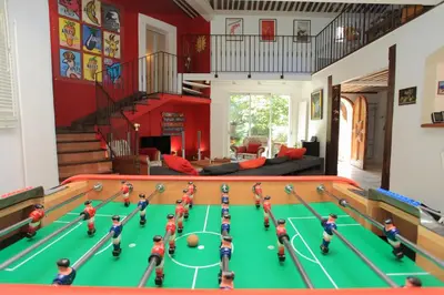 a room with a toy soccer game on a table at Charm in Provence in Saumane-de-Vaucluse
